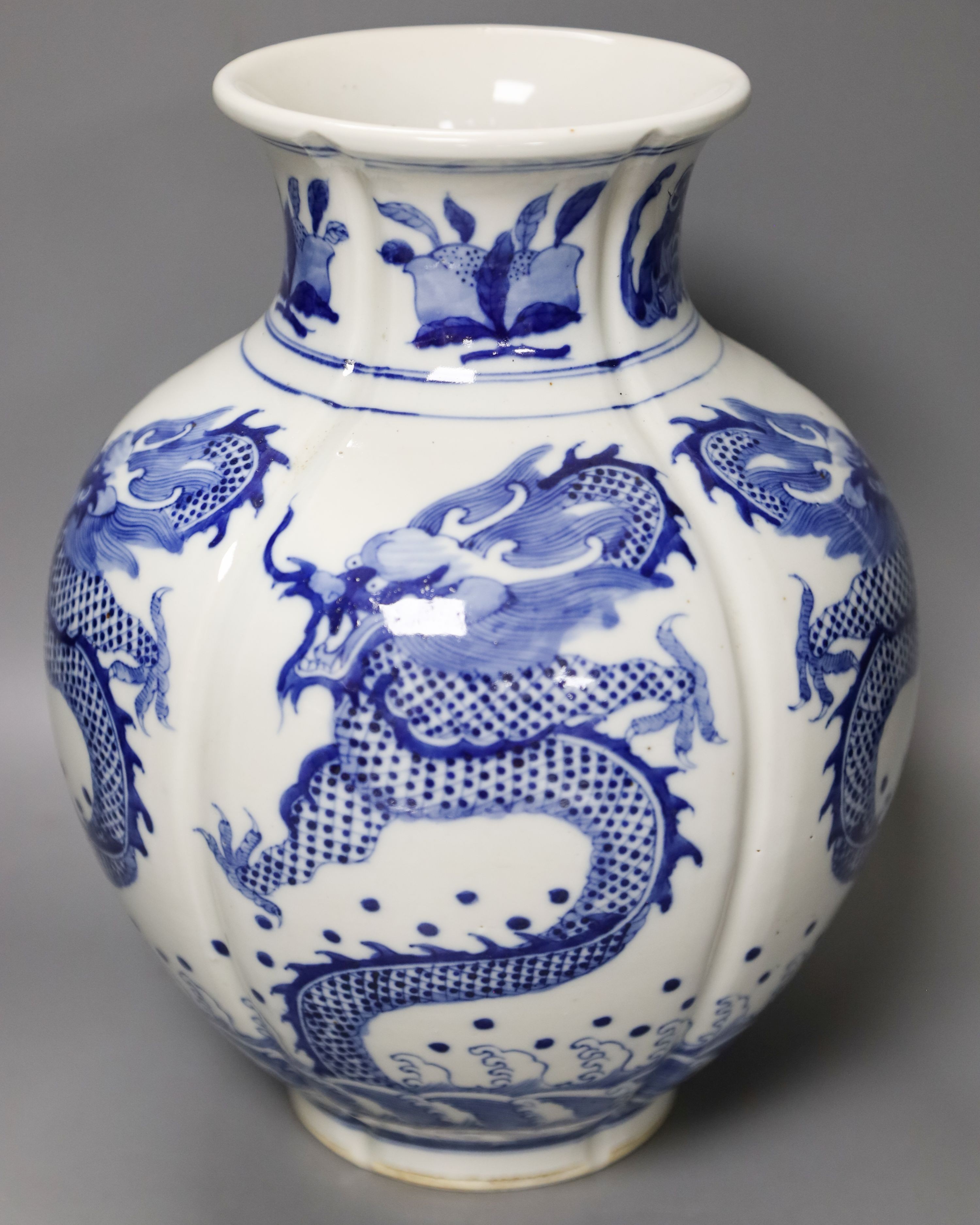 A large Chinese blue and white ‘dragon’ lobed vase, 30cm